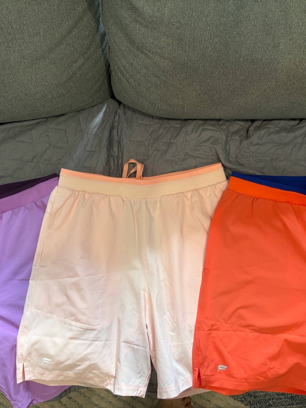 Fabletics Men's Athletic Shorts Trio — Lavender, Light Pink, Coral/Orange